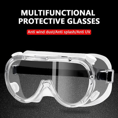 Clear protective goggles with black elastic strap, vented frame and transparent wraparound lens against a black background.