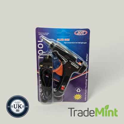 Black 20W mini hot glue gun in retail packaging with an orange trigger, metal nozzle, mains cable and UK plug.