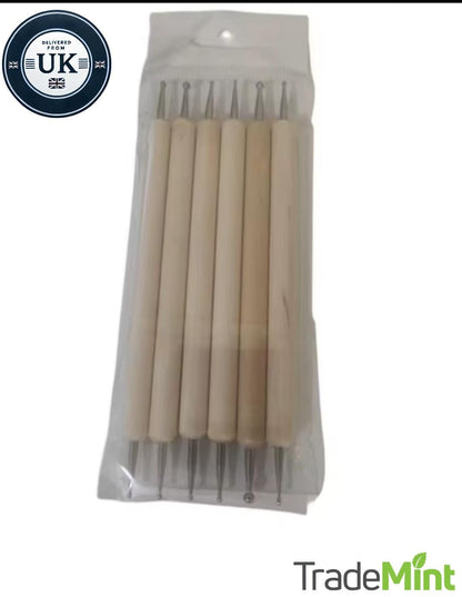 Six double-ended wooden embossing stylus tools with metal ball tips in clear plastic retail packaging.