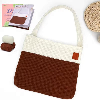 Brown and cream crocheted shoulder tote with long strap, yarn balls and illustrated crochet bag pattern booklet.