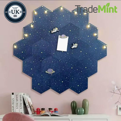 Navy hexagonal felt pinboards arranged into a starry wall display with fairy lights and pinned notes.