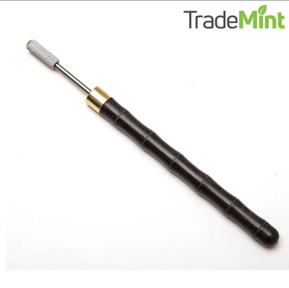 Black ebony-handled leather edge paint roller pen with silver tip and brass collar.