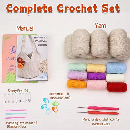 Cream crochet shoulder bag kit contents with coloured yarn, hooks, sewing needles, safety pins and stitch markers.