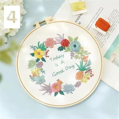 Round floral embroidery design featuring pastel stitched flowers and the words Today Is A Good Day.