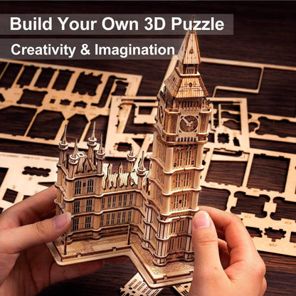 Hands holding the assembled Big Ben wooden 3D puzzle in front of sheets of laser-cut wooden parts.