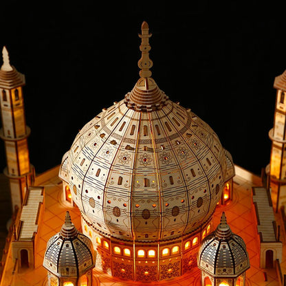 Close-up of ornately patterned central dome on lit wooden Taj Mahal 3D model.