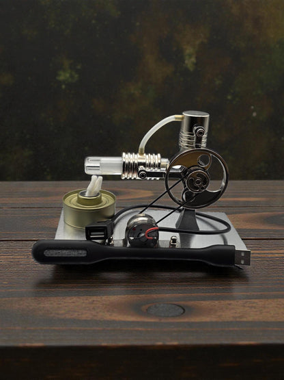 Stirling engine model displayed with black USB cable in front of metal flywheel and burner.