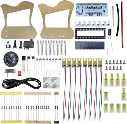 Electronic laser harp kit parts laid out with circuit boards, resistors, screws, wires, sensors and speaker.