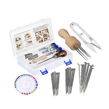Needle felting starter kit parts laid out with multiple spare needles, wooden tools and scissors.