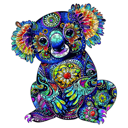 Close-up of colourful koala wooden puzzle illustration with bright mandala motifs and large eyes.