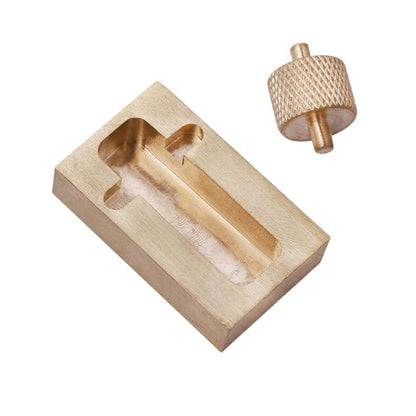 Close-up of brass leather edge oil applicator block and removable knurled metal roller.