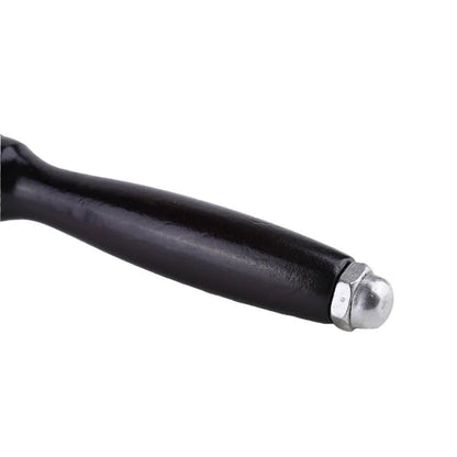 Close-up of the black wooden mallet handle ending in a silver metal cap.
