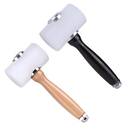 Two white nylon-headed leathercraft mallets with black and natural wooden handles against white.