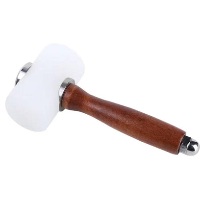 White nylon leathercraft mallet with brown wooden handle against white background.